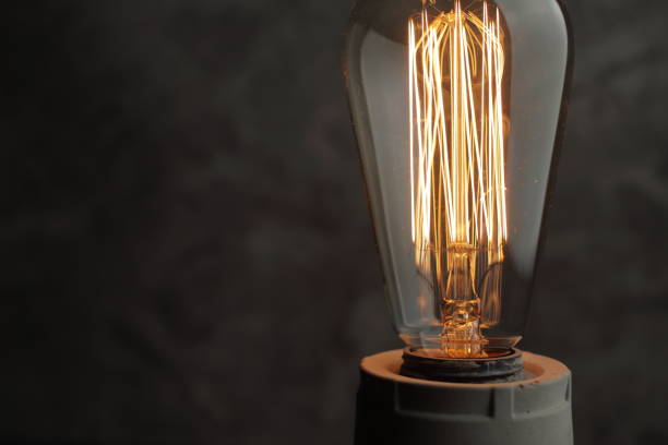 istock Retro lamp with Edison lamp on concrete. A good idea 1255799815