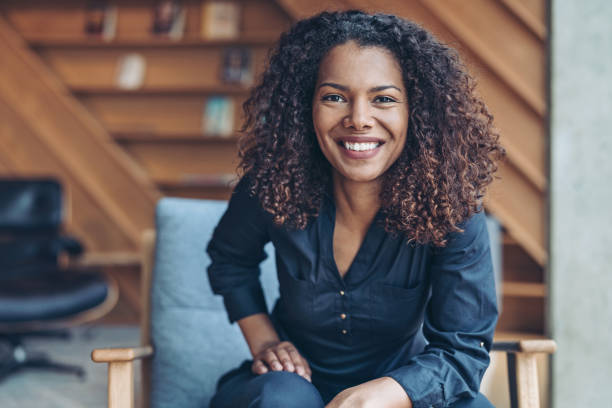 istock Smiling businesswoman in a cozy office 1255800109