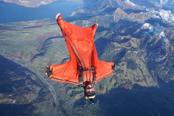 istock Wingsuit flier soars over Swiss Alps 1255802795