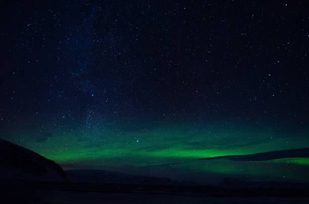 istock Northern Lights over lagoon in Iceland 1255806011