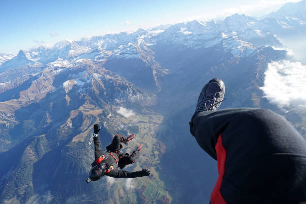 istock Freefall flier soars over Swiss Alps 1255806644