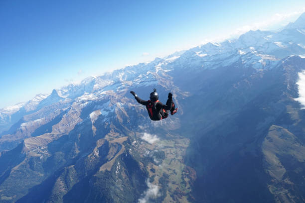 istock Freefall flier soars over Swiss Alps 1255808110