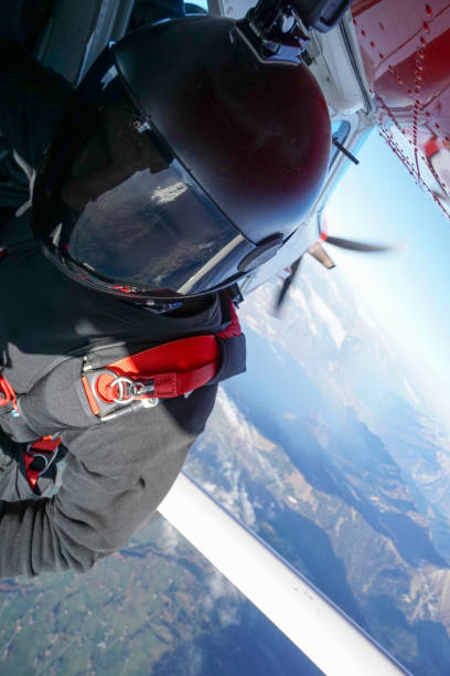 istock View of freefall fliers preparing to descend, from plane 1255808129