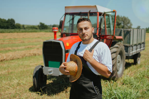 istock Farmer in front of his tractor 1255809836