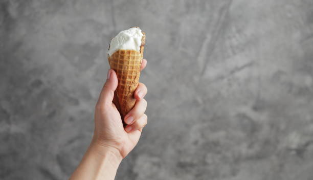 istock Ice cream in a female hand. Sweet dessert 1255811966