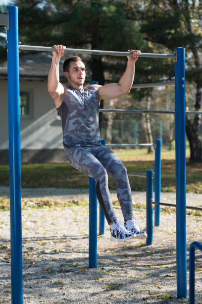 istock Sports Man Training With With Dips Bar 1255812080