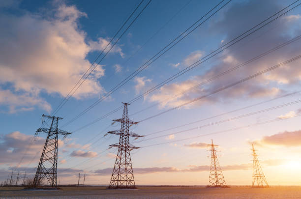 istock Power lines during a beautiful winter sunset. 1255813493