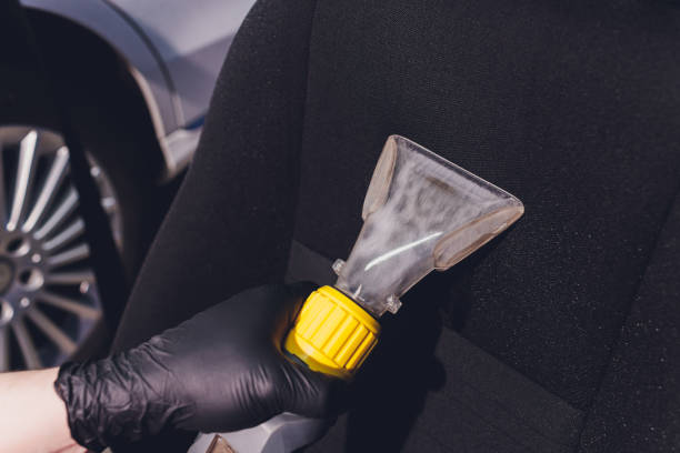 istock Car interior textile seats chemical cleaning with professionally extraction method. Early spring cleaning or regular clean up. 1255814516