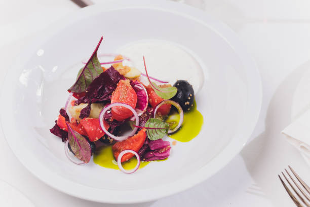 istock Organic Green Avacado and Tomato Salad with Onions. 1255814549