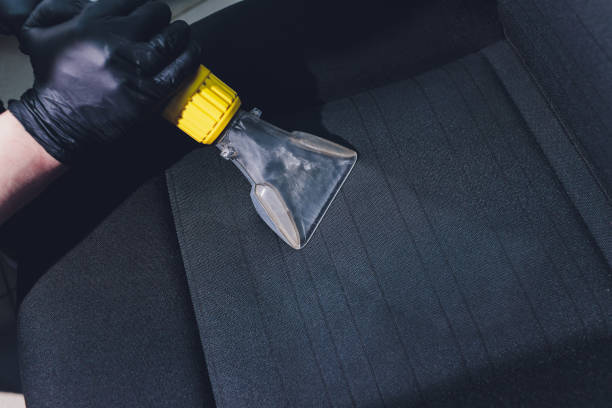 istock Car interior textile seats chemical cleaning with professionally extraction method. baby pink seats. 1255814892