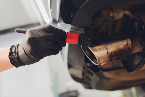 istock Car exhaust pipe with soap. Car wash background. brushing 1255814917