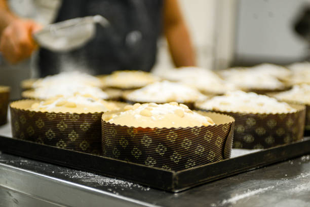 istock Chef baker preparing panettone italian christmas sweet cake in bakery 1255815239