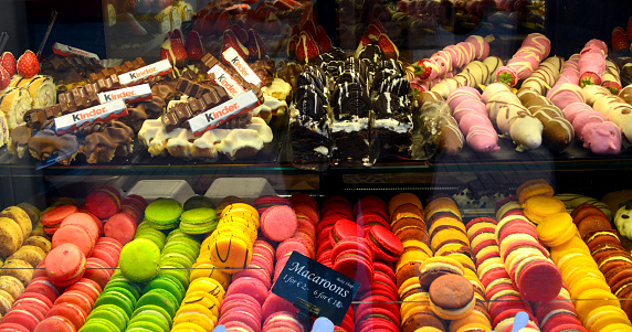 It shows macaroons, chocolates, strawberries and others.
You can find these stores in the downtown of Amsterdam.