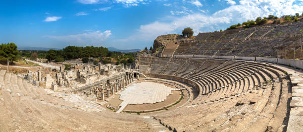 Amphitheater (Coliseum) in Ephesus Panorama of Amphitheater (Coliseum) in ancient city Ephesus, Turkey in a beautiful summer day greek amphitheater stock pictures, royalty-free photos & images