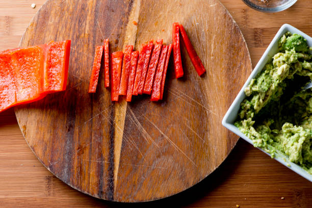 Guacamole. Spicy Guacamole. Avocados diced and mixed with tomatoes, cilantro, red bell peppers, lemon, lime juices and salt and pepper. Classic Tex-mex, Mexican, or American restaurant appetizer, brunch, or lunch entree favorite. Spicy Guacamole. Avocados diced and mixed with tomatoes, cilantro, red bell peppers, lemon, lime juices and salt and pepper. Classic Tex-mex, Mexican, or American restaurant appetizer, brunch, or lunch entree favorite. mex mexican restaurant tex stock pictures, royalty-free photos & images