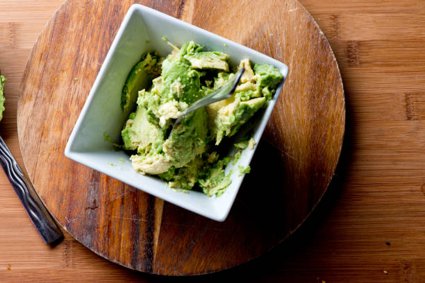 Guacamole. Spicy Guacamole. Avocados diced and mixed with tomatoes, cilantro, red bell peppers, lemon, lime juices and salt and pepper. Classic Tex-mex, Mexican, or American restaurant appetizer, brunch, or lunch entree favorite. Spicy Guacamole. Avocados diced and mixed with tomatoes, cilantro, red bell peppers, lemon, lime juices and salt and pepper. Classic Tex-mex, Mexican, or American restaurant appetizer, brunch, or lunch entree favorite. mex mexican restaurant tex stock pictures, royalty-free photos & images