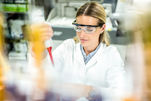 Young Female Scientist Working With Chemicals in Laboratory.