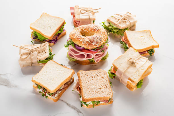 istock fresh sandwiches around bagel on marble white surface 1255822556