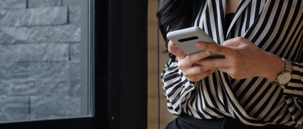 istock Asian woman using smartphone for social network 1255828633
