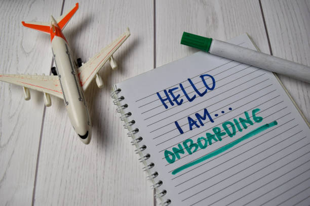 istock Hello I am Onboarding write on a book isolated on Office Desk 1255828649