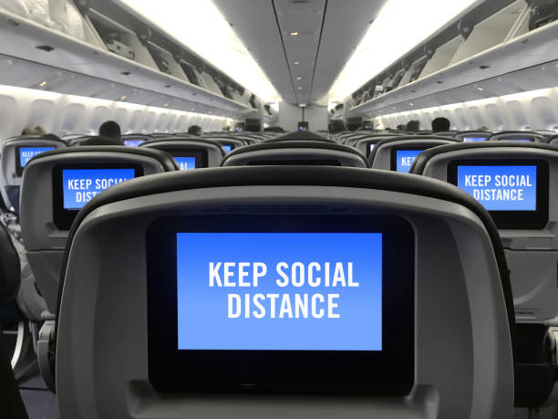 istock Social distancing in airplane 1255830315