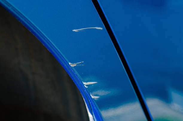 Close-up of the scratches on the blue car stock photo