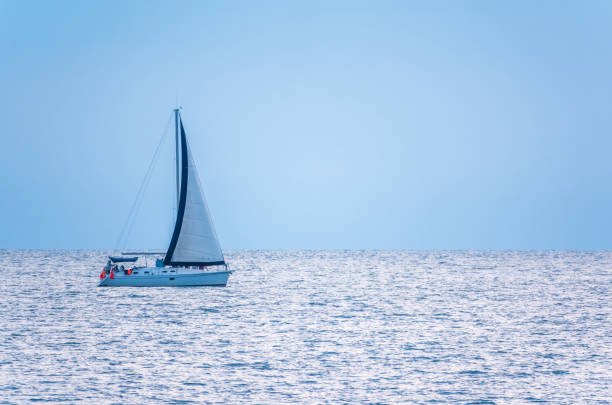 istock Sailing yacht in the blue calm sea. 1255838312