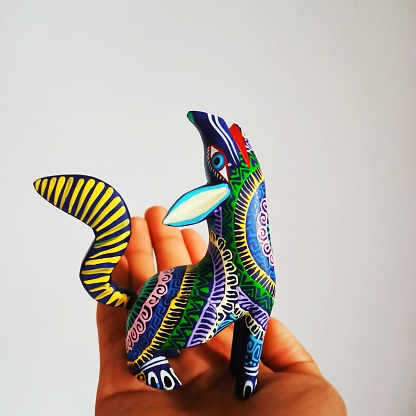 It´s a handcraft made in Mexico, a wooden pieced carved into a a fantastic animal with colorful tones and fictional shapes.