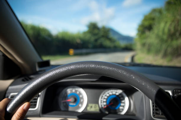 Driving a car on mountain trail