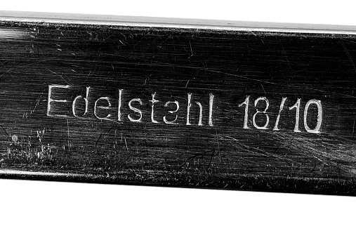 The germa word Edelstahl with number, in englisch stainless stell 18/10