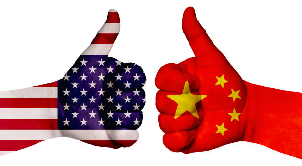 istock Two hands are painted with flags of different countries, with a thumb raised up. China and the USA 1255843599