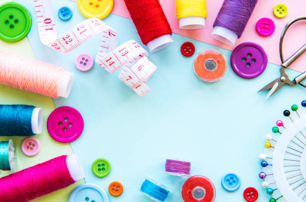 istock Sewing accessories on a blue pastel background 1255846118