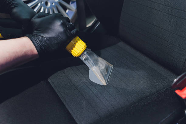istock Car interior textile seats chemical cleaning with professionally extraction method. baby pink seats. 1255846443
