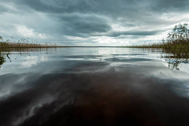 istock Lake and dark clouds, beautiful landscape. 1255847455