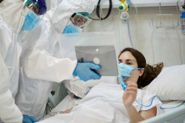 istock Healthcare Worker Holding Tablet for Patient Video Call 1255849334