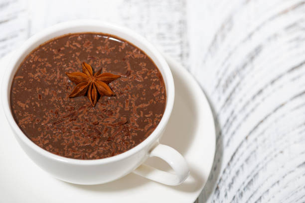 istock cup of hot spiced chocolate on white background 1255849532