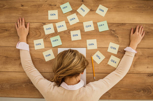 istock Tired female getting out of ideas what to write 1255850725