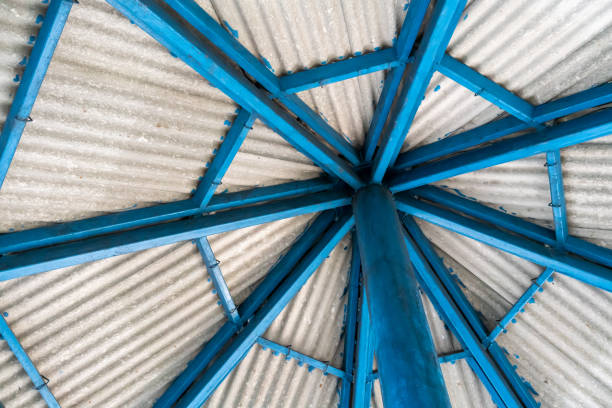 Blue metal roof structure with grey roof tile on top.