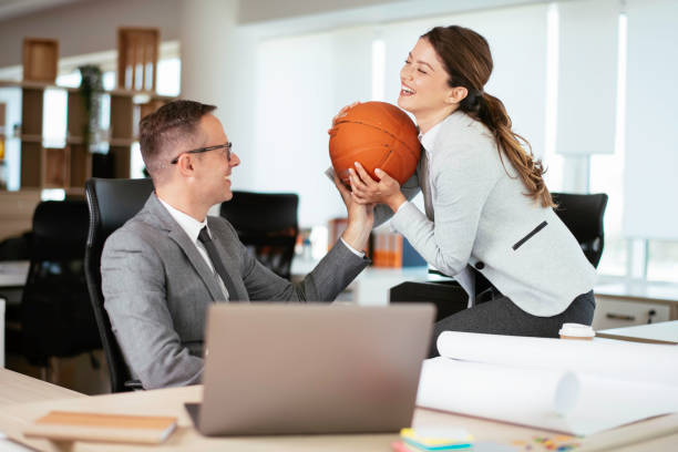 istock Businessman and businesswoman working on project. 1255853907