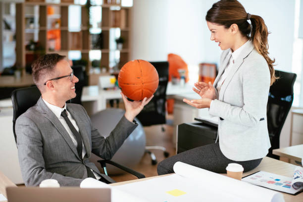 istock Businessman and businesswoman working on project. 1255853932