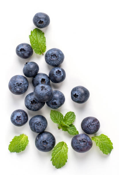 istock Blueberry fruit top view isolated on a white background, flat lay overhead layout with mint leaf, healthy design concept. 1255857122
