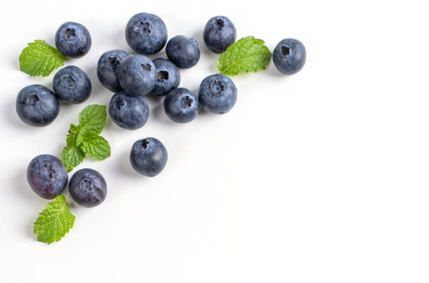 istock Blueberry fruit top view isolated on a white background, flat lay overhead layout with mint leaf, healthy design concept. 1255857135