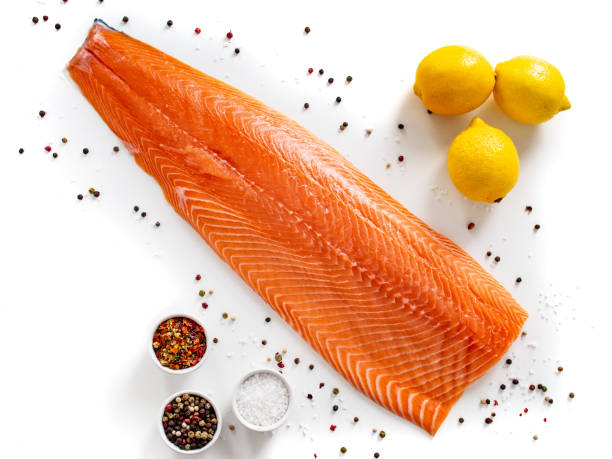 istock Fresh raw salmon fillet on white background 1255857312