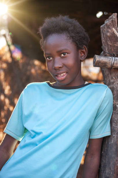 istock small african girl standing in her yard 1255857480