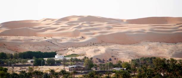 istock Houses in valley under sand dunes 1255857937