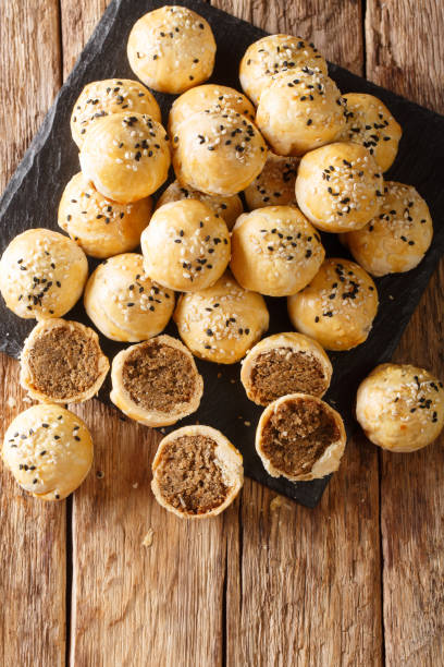 istock Tau Sar Piah or Tambun Biscuits are baked flaky pastry biscuits filled made from grounded mung beans closeup. Vertical top view 1255863271