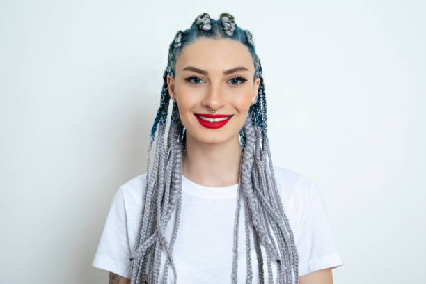 istock Beautiful young woman looking at camera 1255864962