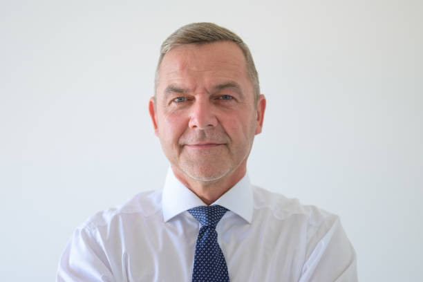 istock Serious middle-aged businessman in shirt and tie 1255866476