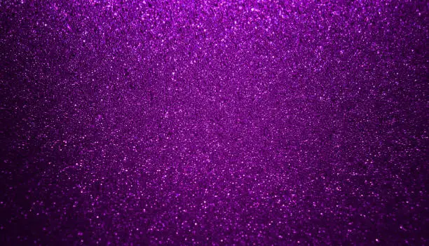 Photo of Shiny purple glitter texture background