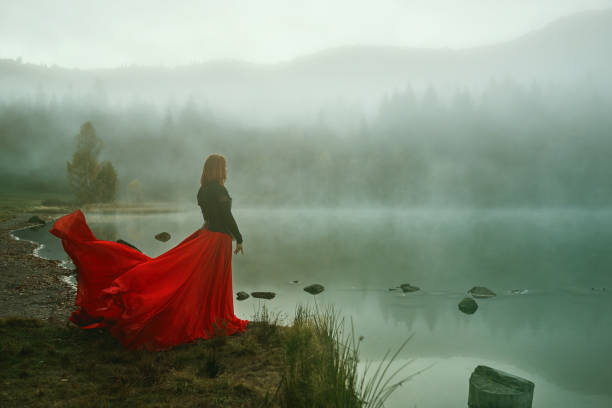 istock Standing in front of lake with fog 1255870649